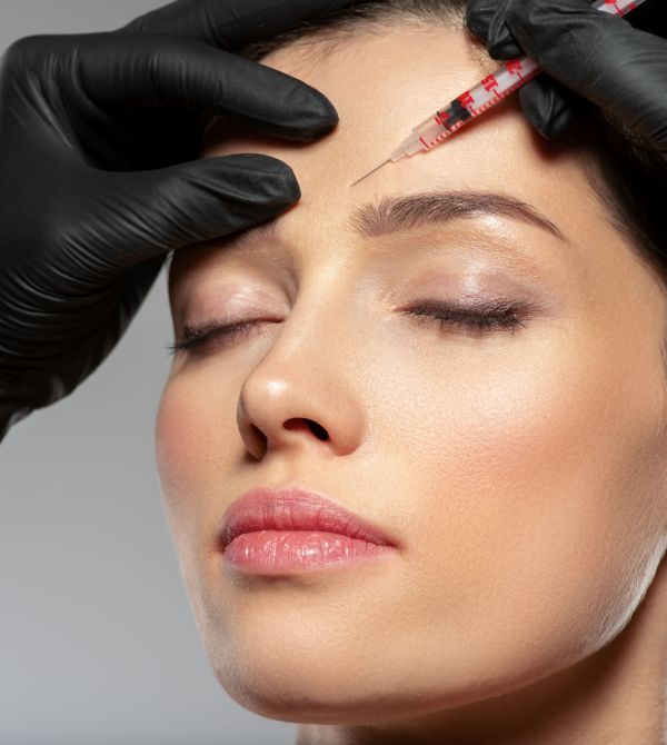 Woman receiving facial filler treatment