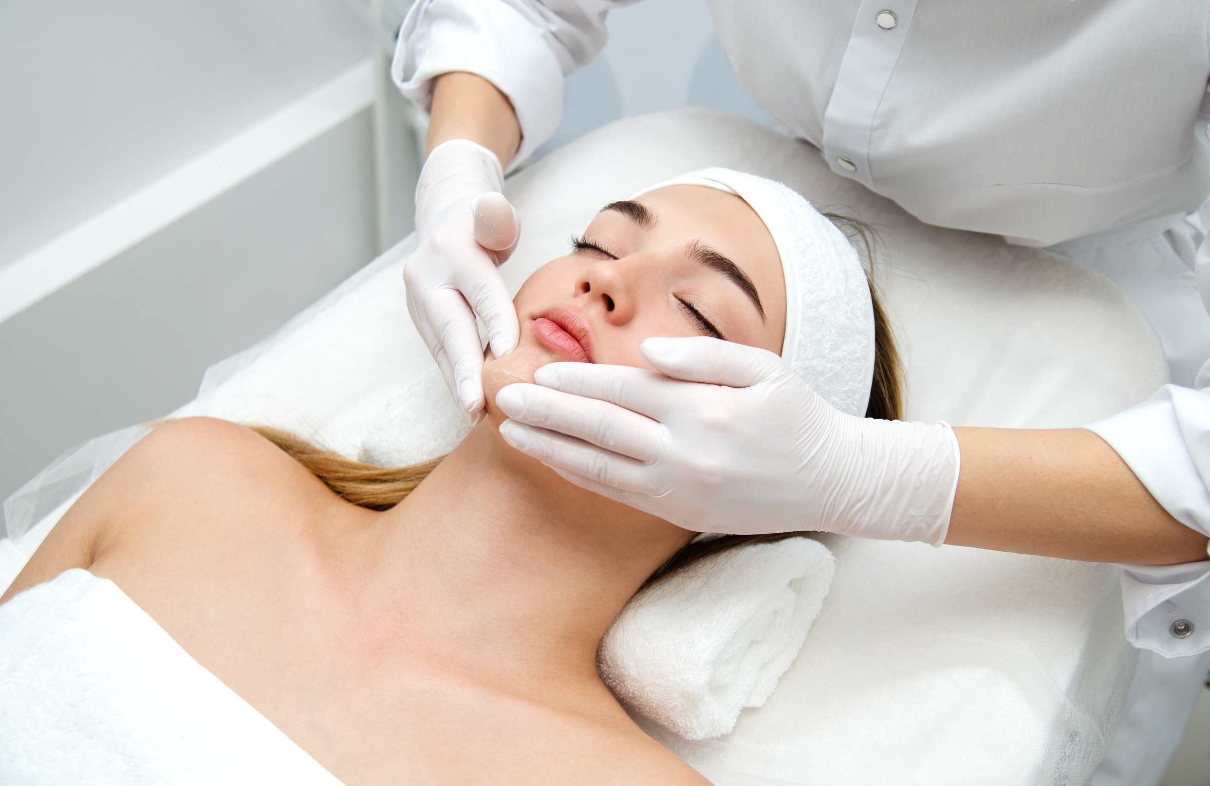 Woman getting face beauty treatment in medical spa center. Skin rejuvenation