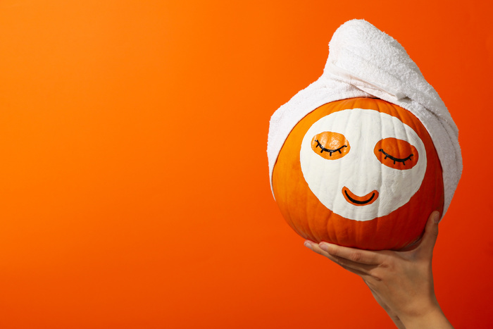 Skin and face care concept - pumpkin beauty benefits